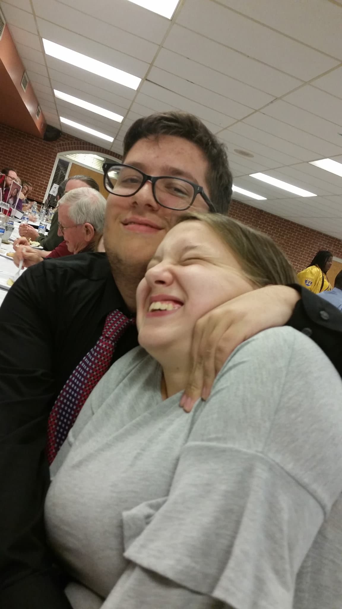David and Jennifer sharing a laugh at a family dinner