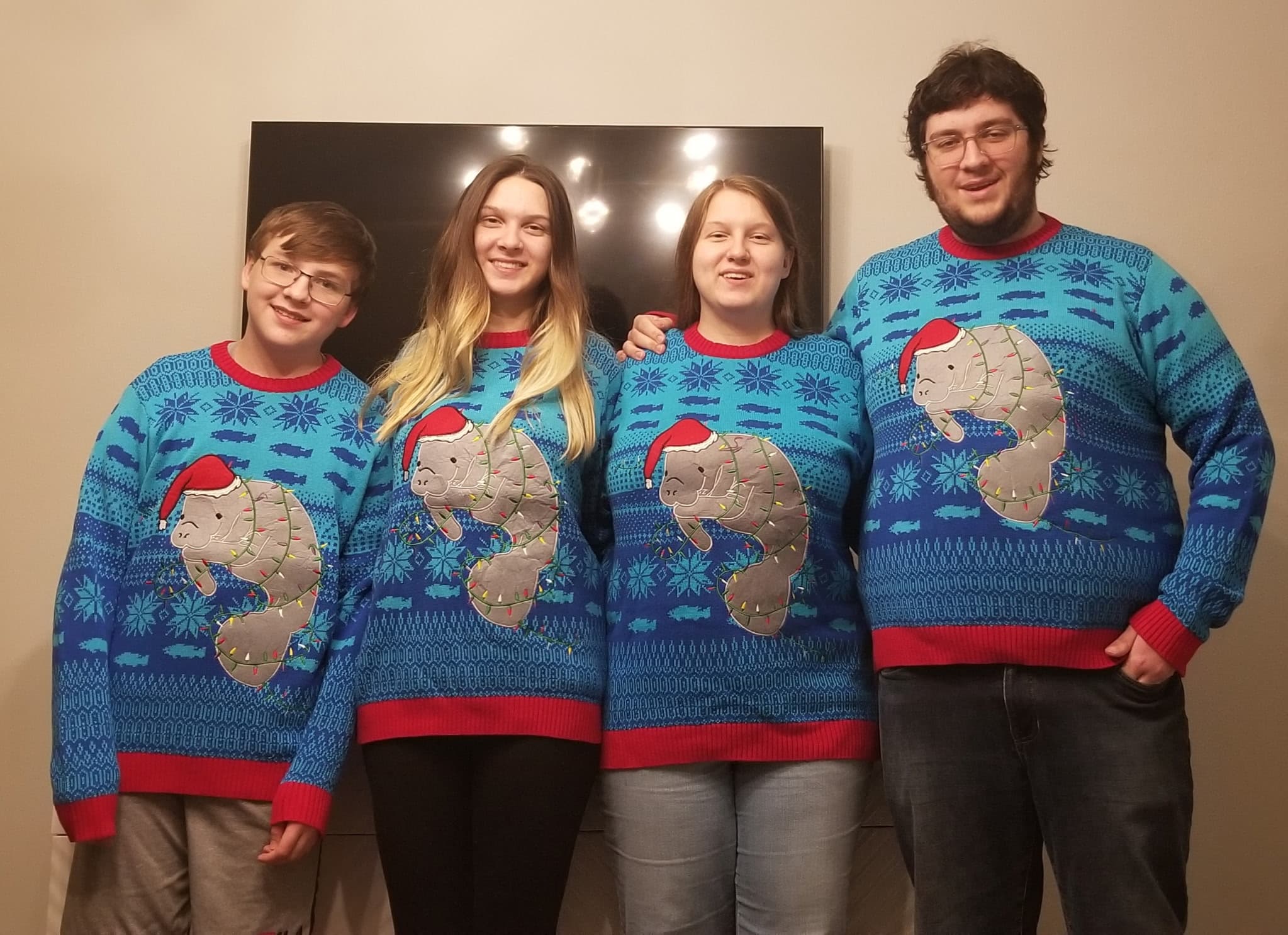 David and friends in matching manatee sweaters