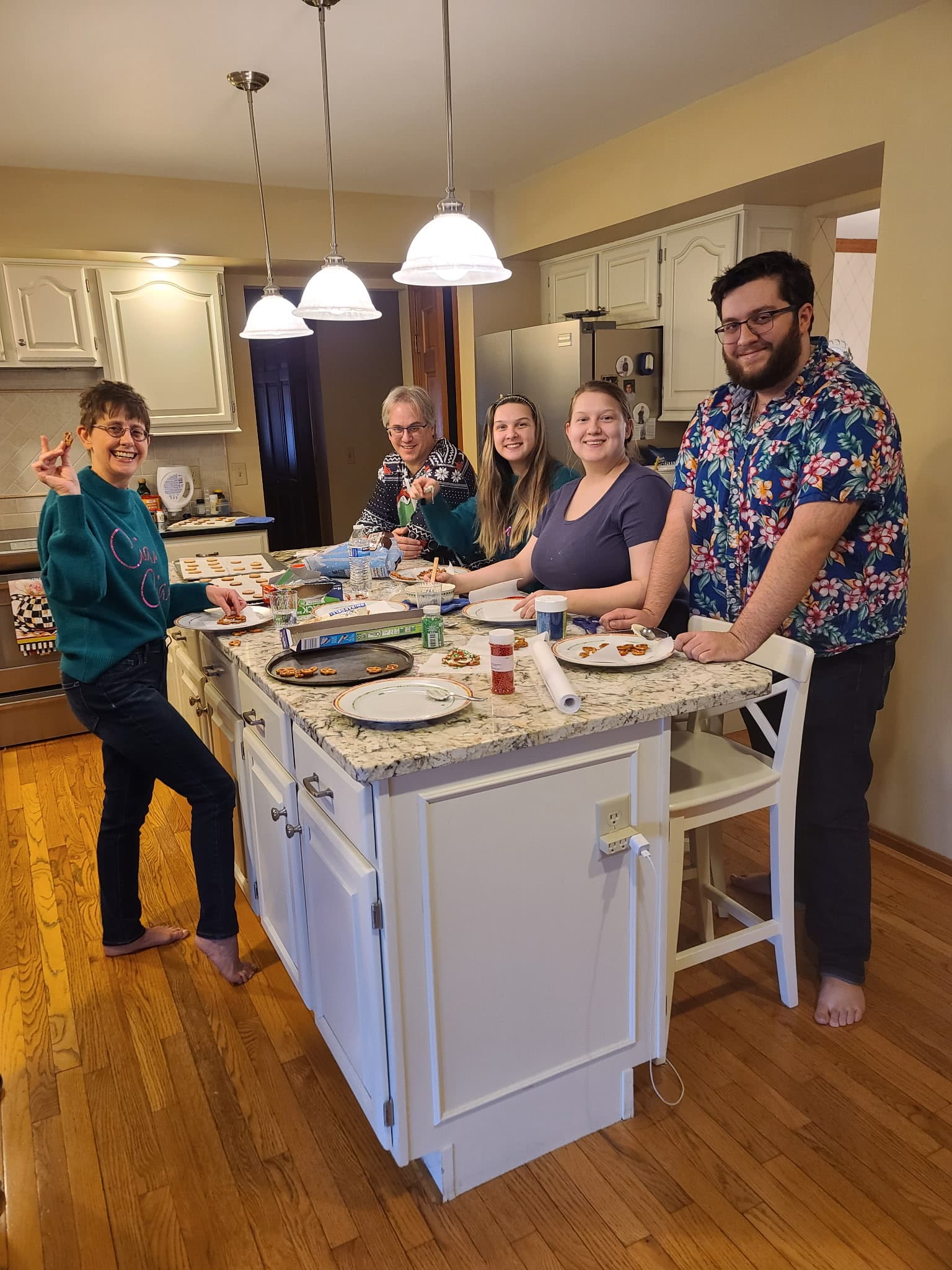 David and family decorating cookies together