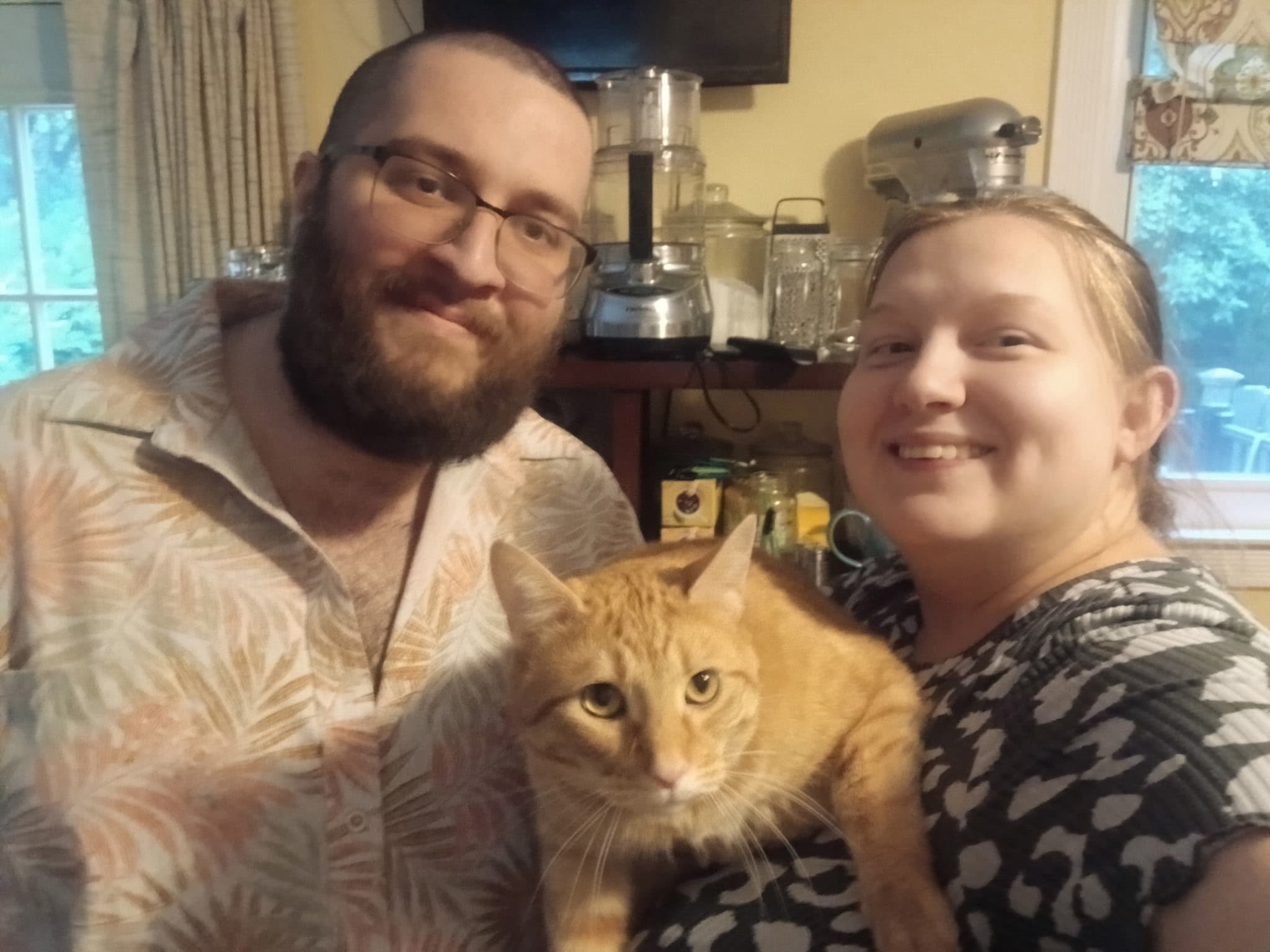 David and Jennifer at home with their cat