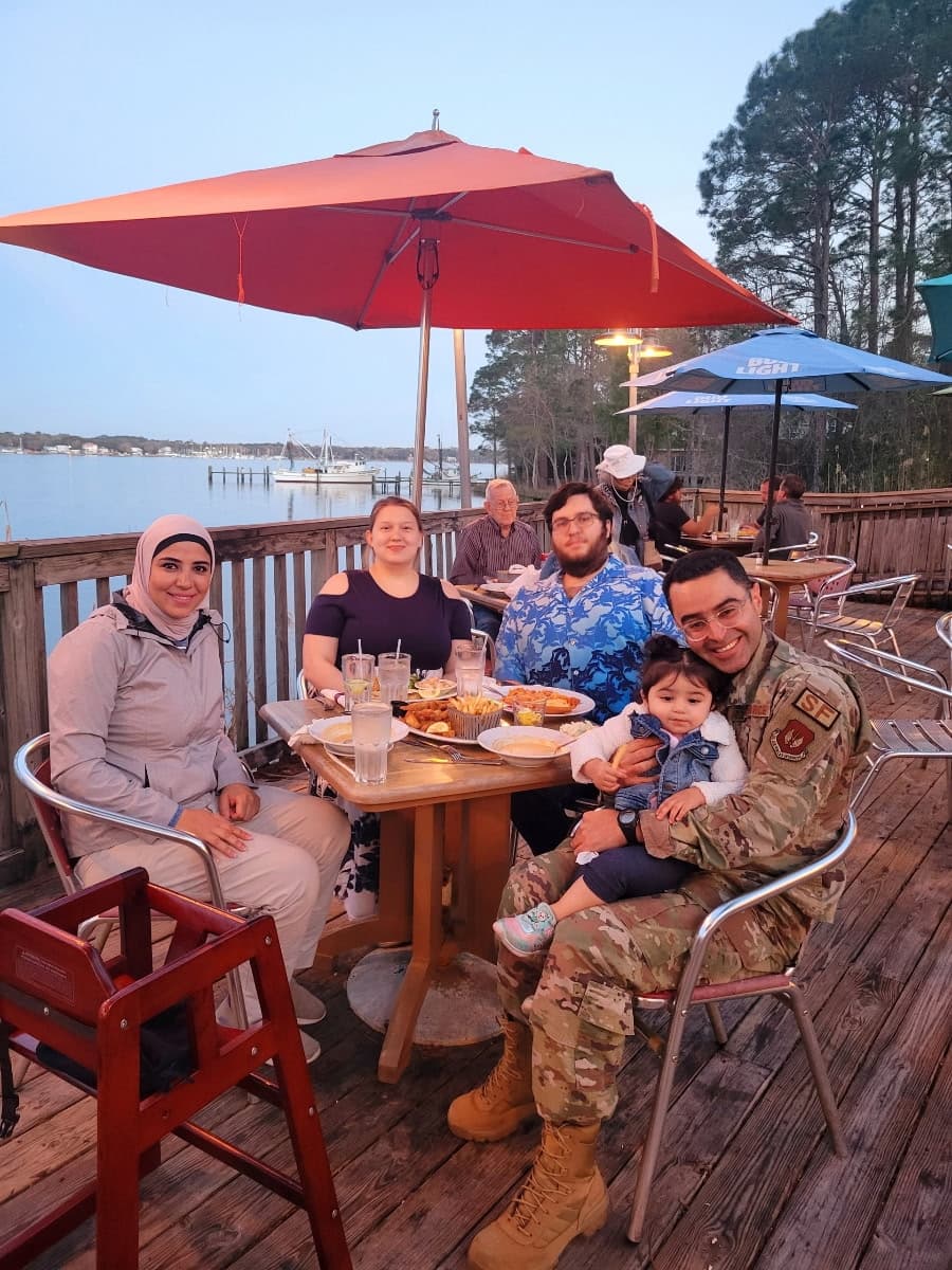 David and family having dinner by the water