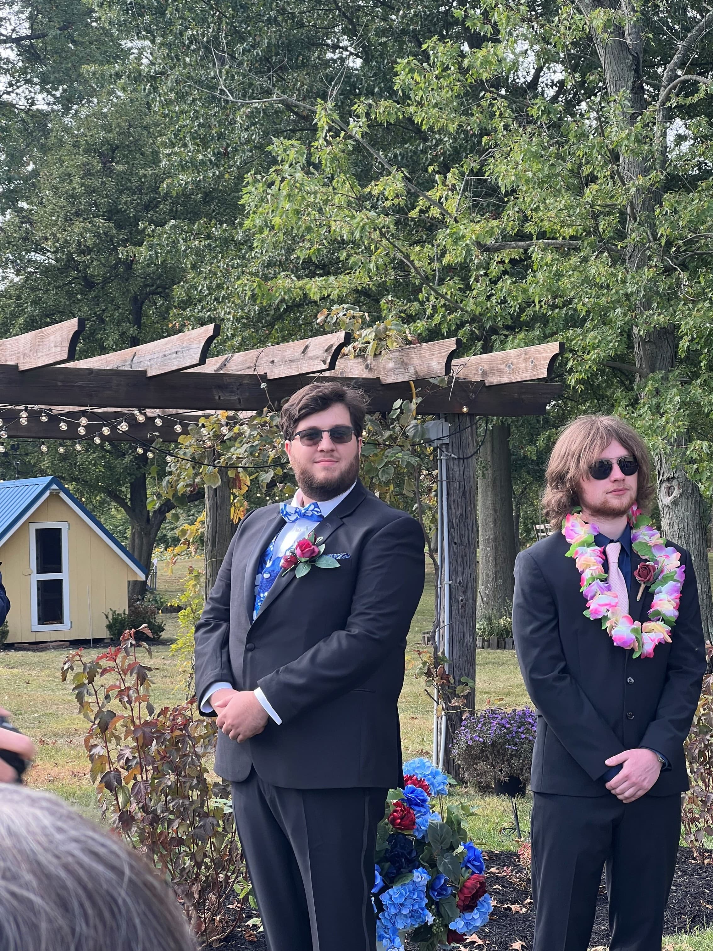 David at his wedding, standing with a groomsman